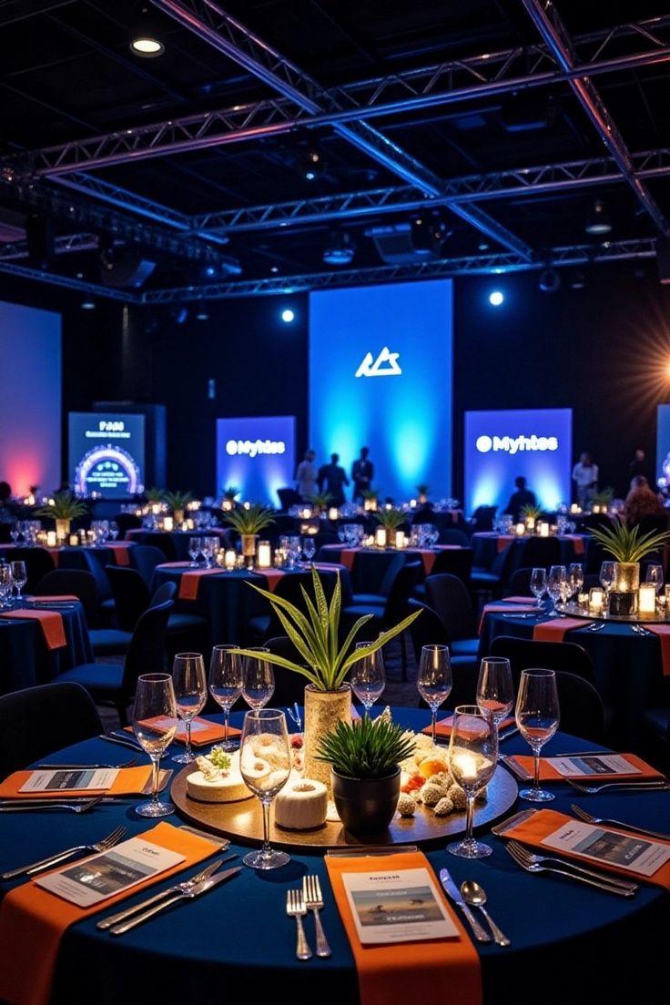 Elegant-Party-Ambiance_-Dimly-Lit-Banquet-Hall-with-Blue-Tablecloths-and-Candles